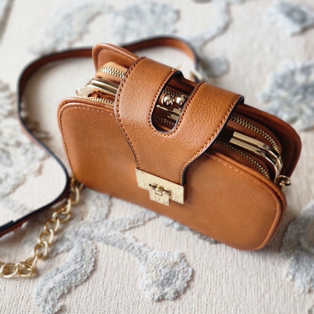 Classic brown handbag with detachable strap.